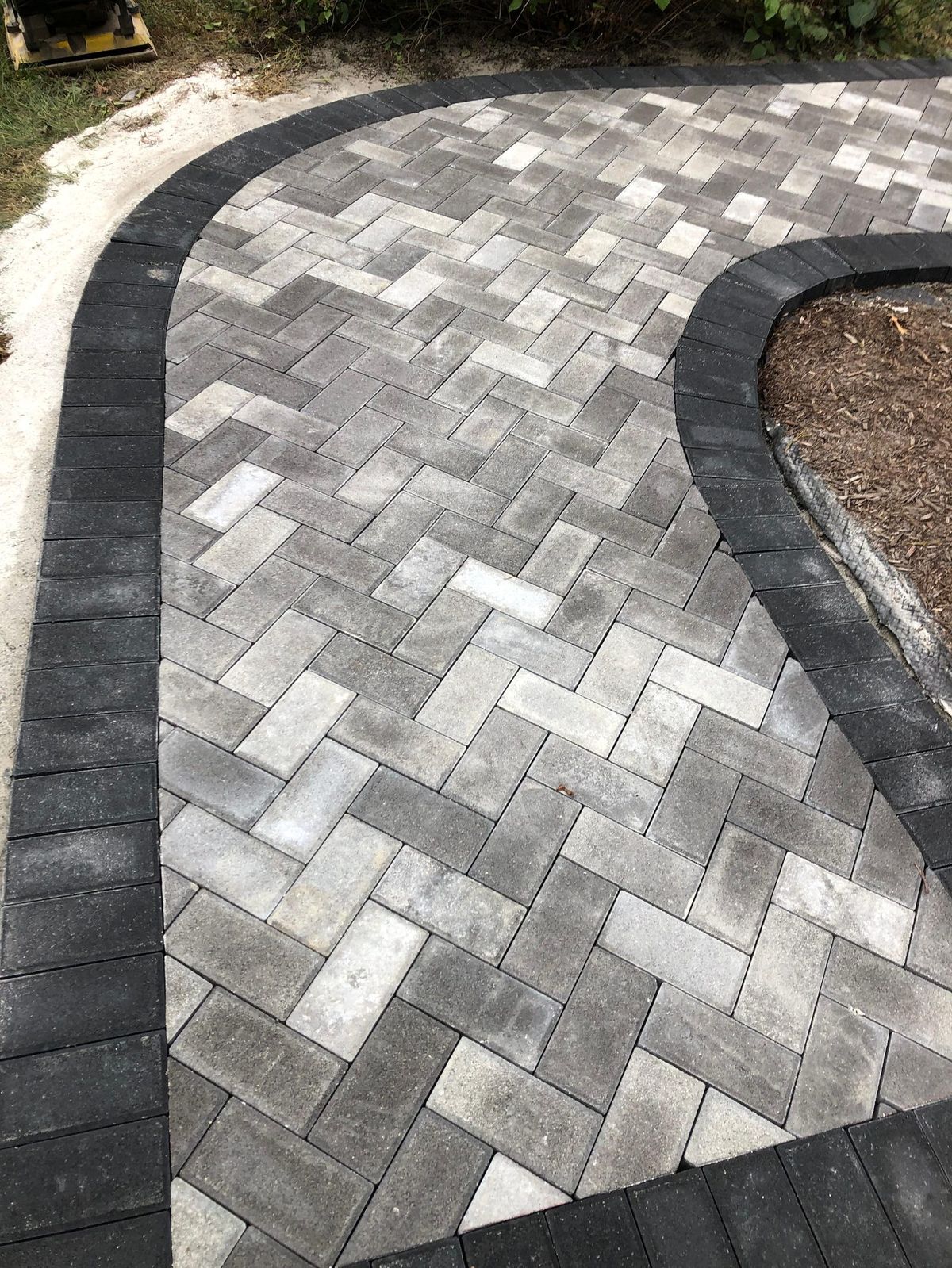 Herringbone pavers with charcoal border